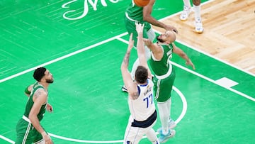 Jun 17, 2024; Boston, Massachusetts, USA; Dallas Mavericks guard Luka Doncic (77) shoots against Boston Celtics guard Derrick White (9) in the third quarter during game five of the 2024 NBA Finals at TD Garden. Mandatory Credit: David Butler II-USA TODAY Sports