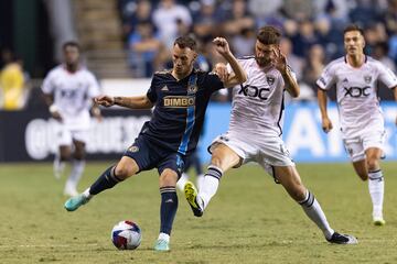 Daniel Gazdag battles for the ball against D.C. United midfielder Mateusz Klich at Subaru Park.