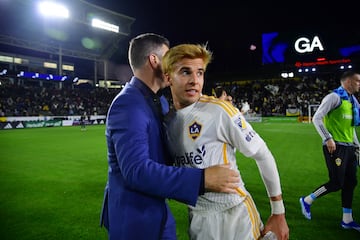 LA Galaxy midfielder Riqui Puig (10) and head coach Greg Vanney celebrate after the win against Houston Dynamo.